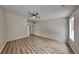 Spacious bedroom features a modern ceiling fan and beautiful hardwood floors at 1229 Huntington Place Cir, Lithonia, GA 30058