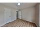 Bedroom features modern flooring, base trim and a double-hung window at 1229 Huntington Place Cir, Lithonia, GA 30058