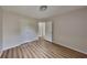 Bedroom features modern flooring, base trim and a double-hung window at 1229 Huntington Place Cir, Lithonia, GA 30058