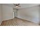 Spacious bedroom features a modern ceiling fan and beautiful hardwood floors at 1229 Huntington Place Cir, Lithonia, GA 30058
