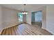 Bright dining room with new flooring, updated lighting, and ample natural light at 1229 Huntington Place Cir, Lithonia, GA 30058