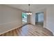 Bright dining room with new flooring, updated lighting, and ample natural light at 1229 Huntington Place Cir, Lithonia, GA 30058