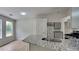 Well-lit kitchen featuring stainless steel appliances, granite countertops, and new flooring at 1229 Huntington Place Cir, Lithonia, GA 30058