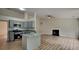 Spacious living space with modern kitchen, fireplace, and open layout, perfect for entertaining at 1229 Huntington Place Cir, Lithonia, GA 30058
