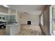 Bright and airy living space showcasing an open floor plan, fireplace, and modern kitchen at 1229 Huntington Place Cir, Lithonia, GA 30058