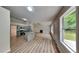 Open living space offering new floors, modern kitchen, and fireplace at 1229 Huntington Place Cir, Lithonia, GA 30058