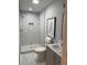 Modern bathroom with a tiled shower, sleek vanity, and stylish decor at 2135 Niskey Lake Sw Rd, Atlanta, GA 30331