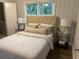 Serene bedroom with a tufted headboard, soft bedding, and modern nightstands at 2135 Niskey Lake Sw Rd, Atlanta, GA 30331