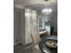 Bright kitchen nook with custom white cabinets, bench seating and decorative lighting at 2135 Niskey Lake Sw Rd, Atlanta, GA 30331