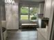 Bright kitchen nook with custom white cabinets, bench seating and decorative lighting at 2135 Niskey Lake Sw Rd, Atlanta, GA 30331