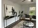 Bright living room with a glass coffee table, neutral decor, and comfortable seating at 2135 Niskey Lake Sw Rd, Atlanta, GA 30331