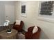 Inviting sitting area with comfortable chairs, decorative artwork, and stylish wood table at 2135 Niskey Lake Sw Rd, Atlanta, GA 30331