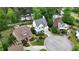 Aerial view of three homes and a circular driveway at the end of a cul-de-sac near a lake at 2548 Lakeview East Se Trl, Atlanta, GA 30316