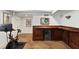 Basement bar area featuring dark wooden walls, a wine refrigerator and an exercise bike and computer at 2548 Lakeview East Se Trl, Atlanta, GA 30316