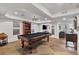 Spacious basement with a pool table, tile flooring and bar area, ideal for recreation and entertaining at 2548 Lakeview East Se Trl, Atlanta, GA 30316