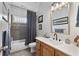 Cozy bathroom featuring a tub with shower, a vanity with a mirror, and tiled floors at 2548 Lakeview East Se Trl, Atlanta, GA 30316