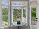 Light-filled breakfast nook with lake view, bay window, and access to the outdoor patio at 2548 Lakeview East Se Trl, Atlanta, GA 30316