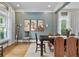 Comfortable dining room featuring natural light, stylish decor, and hardwood floors at 2548 Lakeview East Se Trl, Atlanta, GA 30316