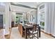Bright dining room with large windows, hardwood floors, and a large table for entertaining at 2548 Lakeview East Se Trl, Atlanta, GA 30316