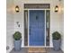Elegant front door with side lights, decorative hardware, and potted plants at 2548 Lakeview East Se Trl, Atlanta, GA 30316