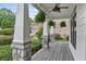 Spacious covered porch featuring stone columns, and a beautiful ceiling fan at 2548 Lakeview East Se Trl, Atlanta, GA 30316