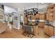 Spacious kitchen with hardwood floors, light wood cabinets, stainless appliances, and island seating at 2548 Lakeview East Se Trl, Atlanta, GA 30316