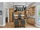 Bright eat-in kitchen features a center island, granite counters, stainless appliances, and hanging pot rack at 2548 Lakeview East Se Trl, Atlanta, GA 30316
