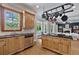 Open concept kitchen with natural wood cabinets, granite countertops, and stainless steel appliances at 2548 Lakeview East Se Trl, Atlanta, GA 30316