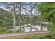 A gravel path runs beside a lake, with mature trees beside the water providing privacy at 2548 Lakeview East Se Trl, Atlanta, GA 30316