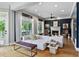 Living room features hardwood floors, a fireplace, neutral decor, and access to an outdoor porch at 2548 Lakeview East Se Trl, Atlanta, GA 30316