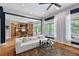 Open-concept living room offers hardwood floors, neutral decor, plenty of light, and views of the backyard at 2548 Lakeview East Se Trl, Atlanta, GA 30316
