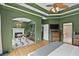 A view of the main bedroom leads into the study featuring a fireplace and built-in bookcase, and the ensuite bathroom at 2548 Lakeview East Se Trl, Atlanta, GA 30316