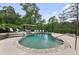 Backyard pool area with mature landscaping and waterfalls and a pergola with outdoor furniture at 2548 Lakeview East Se Trl, Atlanta, GA 30316