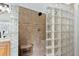 Detailed view of the shower featuring a glass block partition and tiled surround at 2548 Lakeview East Se Trl, Atlanta, GA 30316