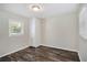 Well-lit bedroom with a built-in cabinet and hardwood-style floors at 3436 Dodson Ter, Atlanta, GA 30344