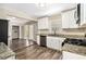 Modern kitchen featuring granite countertops, stainless steel appliances, and updated cabinets at 3436 Dodson Ter, Atlanta, GA 30344