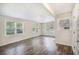 Bright living room featuring beautiful hardwood floors and large windows that let in natural light at 3436 Dodson Ter, Atlanta, GA 30344