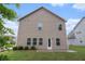 The backyard has a patio and a well-maintained lawn, providing a private outdoor area at 345 Lara Ln, Mcdonough, GA 30253