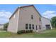 Backyard view of home with well-kept lawn area and well maintained exterior with a patio at 345 Lara Ln, Mcdonough, GA 30253