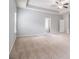 Bright, spacious bedroom with neutral carpet, tray ceiling and a ceiling fan at 345 Lara Ln, Mcdonough, GA 30253