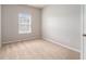 A carpeted bedroom with window provides a comfortable and naturally lit space at 345 Lara Ln, Mcdonough, GA 30253