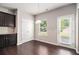 Bright kitchen and dining area with granite countertops, and a door leading to the backyard at 345 Lara Ln, Mcdonough, GA 30253