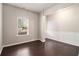 Bright living room featuring hardwood floors, elegant wainscoting, and large windows at 345 Lara Ln, Mcdonough, GA 30253