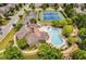 An aerial view of a community pool, clubhouse, tennis courts, and playground at 4850 Wilshire Xing, Cumming, GA 30040