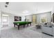 Finished basement featuring a pool table, comfortable seating, and a neutral color palette at 4850 Wilshire Xing, Cumming, GA 30040