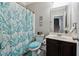 Cozy bathroom featuring leafy blue shower curtain, soft bathmat, and charming decor at 4850 Wilshire Xing, Cumming, GA 30040