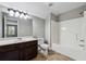 Bathroom featuring a single sink vanity, a tub with shower, and natural light at 4850 Wilshire Xing, Cumming, GA 30040