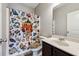 Bathroom featuring gamer-themed shower curtain, vanity, and a mirror at 4850 Wilshire Xing, Cumming, GA 30040