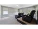 Spacious bonus room with carpet flooring and natural light perfect for entertaining or relaxing at home at 4850 Wilshire Xing, Cumming, GA 30040