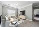 Cozy bonus room with neutral colors, comfortable seating, and a large window at 4850 Wilshire Xing, Cumming, GA 30040